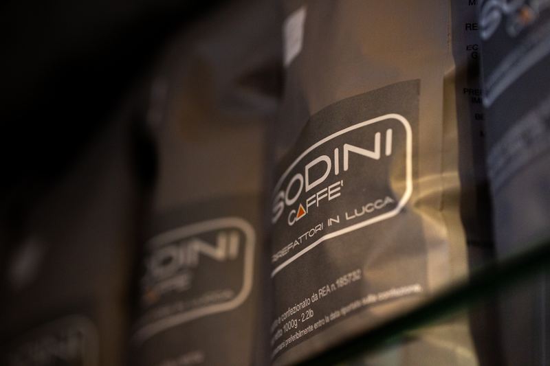Bags of Sodini Caffè coffee on a shelf