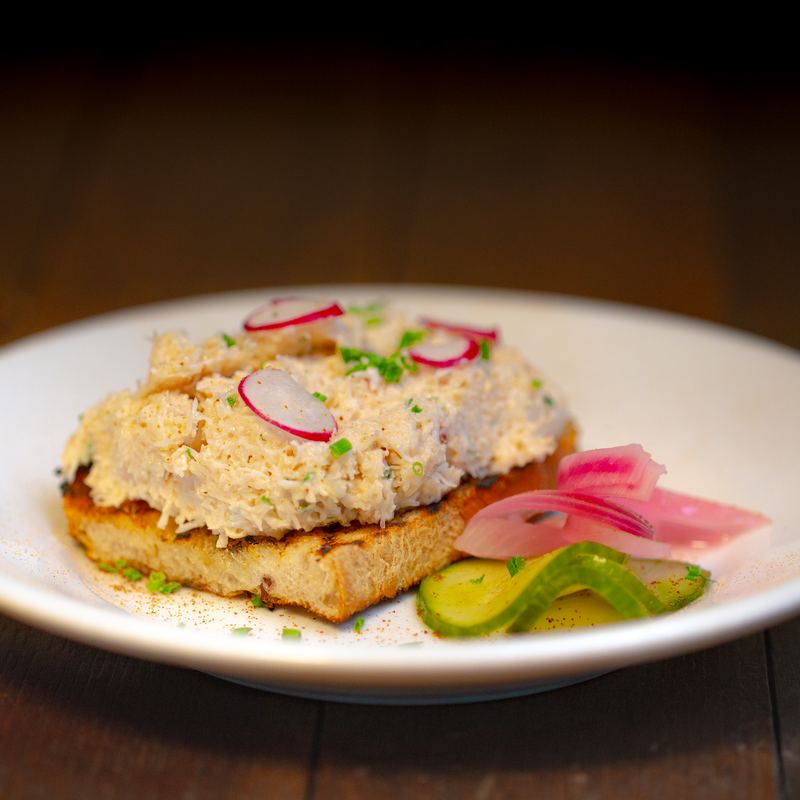 Crab on toast with radish and pickles